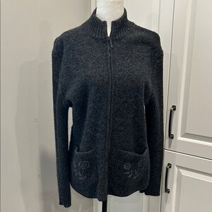 Elegant Black Knit Jacket with Floral Pockets
Wool